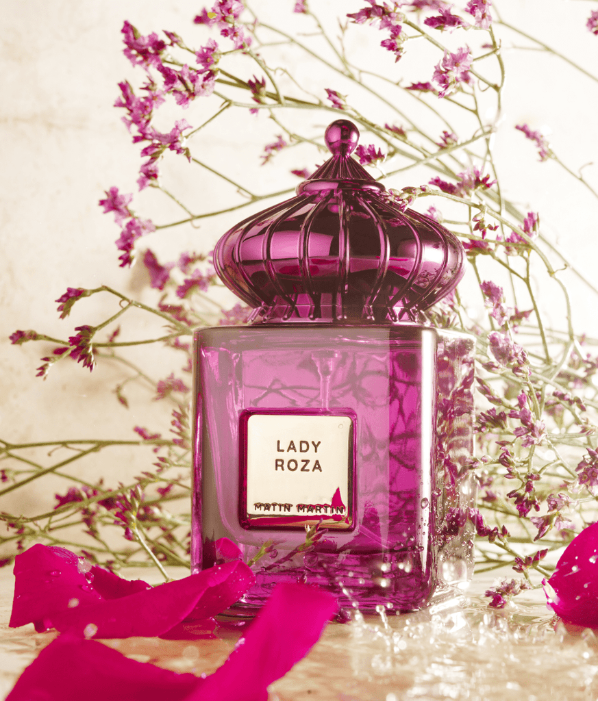 Lady Roza, Expertly blended by Matin Martin, is a decidedly feminine floral bouquet. Dominated by romantic Turkish rose, accompanied by facets of lily of the valley and peony, the scent transcends into a fruity blend of lychee and rhubarb set off by nutmeg for added power and vivacity.  In the base, vanilla, white musks and frankincense create depth and mystery.